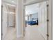 View of the bedroom with a large bed, ceiling fan, and tile flooring at 1941 Mathis Rd, St Cloud, FL 34771