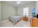 Bedroom features tiled floor, ceiling fan, window and tv at 1941 Mathis Rd, St Cloud, FL 34771