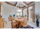 Open-concept dining area with elegant ceiling details, wooden furniture, and seamless access to living spaces at 1941 Mathis Rd, St Cloud, FL 34771