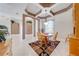 Cozy dining area with a round table, wood chairs, and a decorative ceiling design with ample natural light at 1941 Mathis Rd, St Cloud, FL 34771