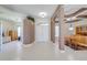 Bright, open foyer with tiled floors, arched doorways, and views of dining and living areas at 1941 Mathis Rd, St Cloud, FL 34771