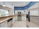 Stylish kitchen with stainless steel appliances, granite counters, and white cabinets at 1941 Mathis Rd, St Cloud, FL 34771