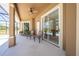 Spacious covered lanai with ceiling fan and view of the screened-in pool area at 1941 Mathis Rd, St Cloud, FL 34771