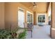 Inviting covered lanai featuring a ceiling fan and seating, with views of the pool and surrounding greenery at 1941 Mathis Rd, St Cloud, FL 34771