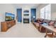 Comfortable living room with a fireplace, large TV, and plush leather seating for relaxation at 1941 Mathis Rd, St Cloud, FL 34771