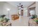 Cozy living room features tile floors, ceiling fan, and ample natural light at 1941 Mathis Rd, St Cloud, FL 34771