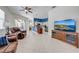 Spacious living area features a large television, cozy seating, and an open layout to the kitchen at 1941 Mathis Rd, St Cloud, FL 34771