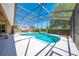Sparkling screened-in pool and spacious deck, perfect for outdoor entertaining and relaxation at 1941 Mathis Rd, St Cloud, FL 34771