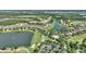 Scenic aerial view showcasing a community with lakes, golf course, and neatly arranged homes at 1948 Molise Dr, Kissimmee, FL 34759