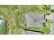 Overhead image of a home showcasing roof and landscaping details in a community setting at 1948 Molise Dr, Kissimmee, FL 34759