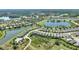 Areal shot featuring a lakefront community with well-kept homes and green spaces at 1948 Molise Dr, Kissimmee, FL 34759