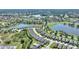 An aerial view of a residential community with ponds and lush greenery at 1948 Molise Dr, Kissimmee, FL 34759