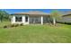 Spacious backyard with a screened lanai, perfect for enjoying the outdoors at 1948 Molise Dr, Kissimmee, FL 34759