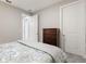 Neutral bedroom with a chest of drawers and white doors is carpeted in a light gray at 1948 Molise Dr, Kissimmee, FL 34759