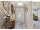 Welcoming entryway with a decorative glass front door, neutral walls, and wood-look tile flooring at 1948 Molise Dr, Kissimmee, FL 34759
