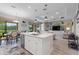 Open-concept kitchen with a large island, modern appliances, and seamless access to the living and dining areas at 1948 Molise Dr, Kissimmee, FL 34759
