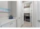 A view into the bright laundry room, with cabinets and light countertop at 1948 Molise Dr, Kissimmee, FL 34759