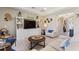 Cozy living room featuring ample seating, a built-in entertainment center, and stylish decor accents at 1948 Molise Dr, Kissimmee, FL 34759