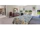 Spacious main bedroom with a large bed, two dressers, two accent chairs and an outdoor view at 1948 Molise Dr, Kissimmee, FL 34759