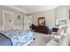 Comfortable main bedroom featuring two dressers, two accent chairs and a view into the main bath at 1948 Molise Dr, Kissimmee, FL 34759