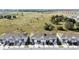 Aerial view of townhomes showing landscaping and green space in the community at 208 Feltrim Reserve Blvd, Davenport, FL 33837