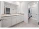 Bathroom with double sink vanity, large mirror, and a shower stall at 208 Feltrim Reserve Blvd, Davenport, FL 33837