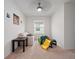 Cozy bedroom with carpet, ceiling fan, and a window at 208 Feltrim Reserve Blvd, Davenport, FL 33837