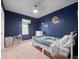 ' bedroom featuring unique decor and a plush carpet at 208 Feltrim Reserve Blvd, Davenport, FL 33837