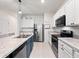 Well-equipped kitchen featuring stainless steel appliances and ample counter space at 208 Feltrim Reserve Blvd, Davenport, FL 33837