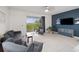 Comfortable living room area with a large sliding glass door at 208 Feltrim Reserve Blvd, Davenport, FL 33837