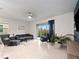 Cozy living room with sliding glass doors leading to the outdoor area at 208 Feltrim Reserve Blvd, Davenport, FL 33837