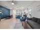 Spacious living area combining seating, kitchen, and dining in an open concept at 208 Feltrim Reserve Blvd, Davenport, FL 33837