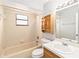Bathroom featuring a shower/tub combo, a toilet and a vanity with wood cabinet at 218 Cranbrook Dr, Kissimmee, FL 34758
