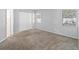 Carpeted bedroom featuring neutral paint, and natural light through windows with blinds at 218 Cranbrook Dr, Kissimmee, FL 34758