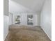 Living room featuring carpeted flooring, neutral paint, and sliding doors to back patio at 218 Cranbrook Dr, Kissimmee, FL 34758