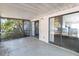 Covered porch with sliding glass doors looking into the home at 218 Cranbrook Dr, Kissimmee, FL 34758