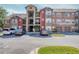 Condominium building featuring ample parking and convenient access to units via exterior stairs at 2203 Key West Ct # 432, Kissimmee, FL 34741