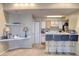 Open-concept living room with breakfast bar and built in shelving, great for entertaining at 2203 Key West Ct # 432, Kissimmee, FL 34741