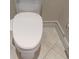 This bathroom features a modern toilet with a soft-close lid, set against tiled flooring at 2234 Callaway Ct, Davenport, FL 33837