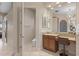 Well-appointed bathroom with vanity, granite counters and neutral tones provides comfort at 2234 Callaway Ct, Davenport, FL 33837