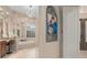 Elegant bathroom with tub, arched window and stylish lighting offers a luxurious retreat at 2234 Callaway Ct, Davenport, FL 33837