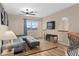 Loft area with gray sectional sofa and modern railings at 2234 Callaway Ct, Davenport, FL 33837