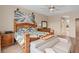 Comfortable bedroom with decorative artwork and ample space for relaxation at 2234 Callaway Ct, Davenport, FL 33837