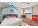 bedroom with colorful rug, playhouse bed, and natural light at 2234 Callaway Ct, Davenport, FL 33837