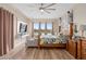 Spacious bedroom with water view, ceiling fan and mounted tv provides a comfortable retreat at 2234 Callaway Ct, Davenport, FL 33837