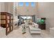 Bright living room with soaring ceilings, fireplace, a large aquarium, and backyard access with beautiful views at 2234 Callaway Ct, Davenport, FL 33837