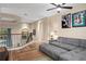 Upstairs loft area with cozy gray seating and modern railings at 2234 Callaway Ct, Davenport, FL 33837