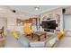 Open-concept living room with modern features, kitchen access, and comfortable seating arrangement at 2234 Callaway Ct, Davenport, FL 33837