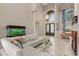 Inviting living room with aquarium, fireplace, soaring ceilings, and a modern, elegant aesthetic with seamless flow at 2234 Callaway Ct, Davenport, FL 33837