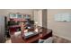 Functional home office space featuring a large desk, ample storage, and natural light at 2234 Callaway Ct, Davenport, FL 33837